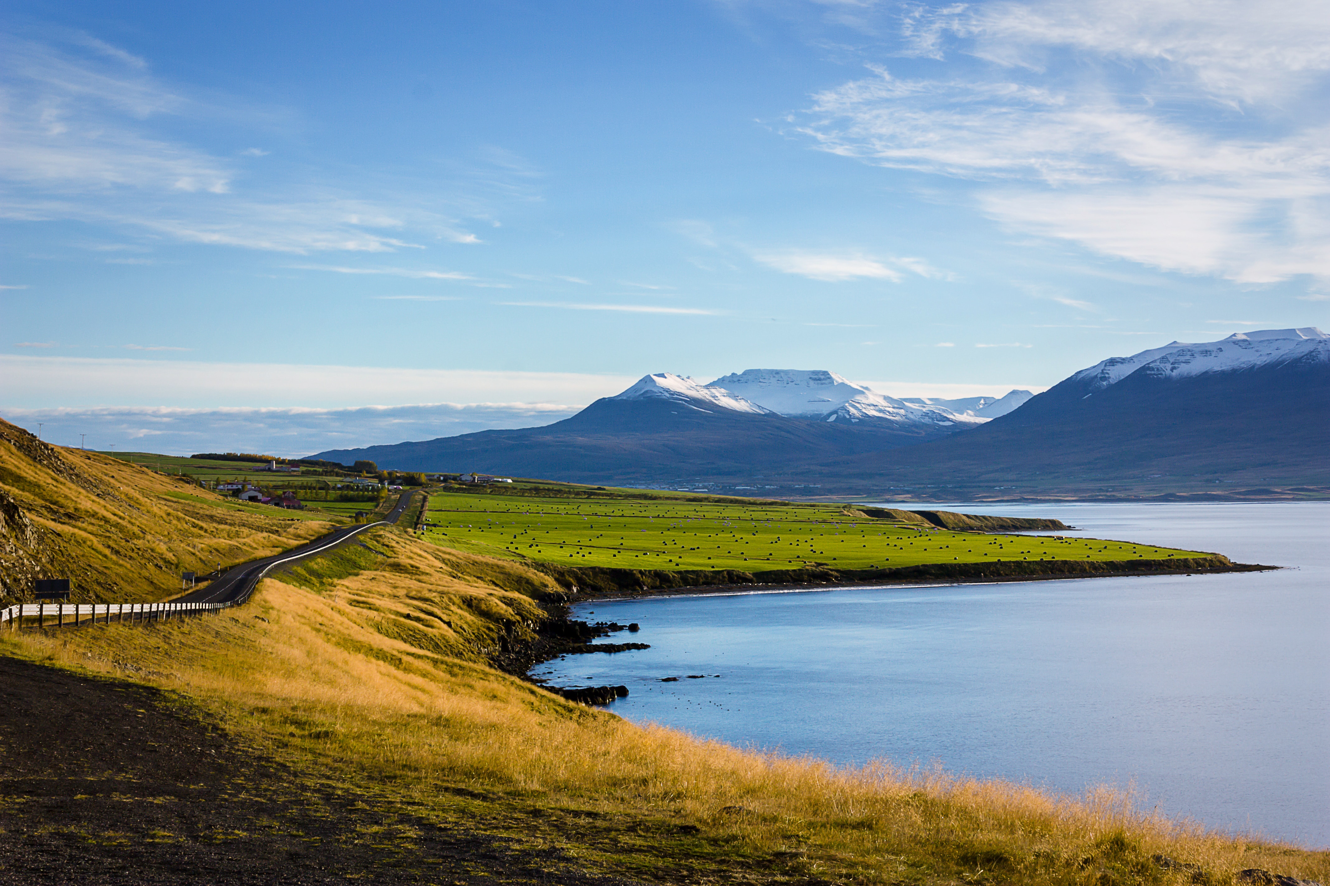 the snow capped mountains are a welcome site as you drive towards the island s second most populated city akurey