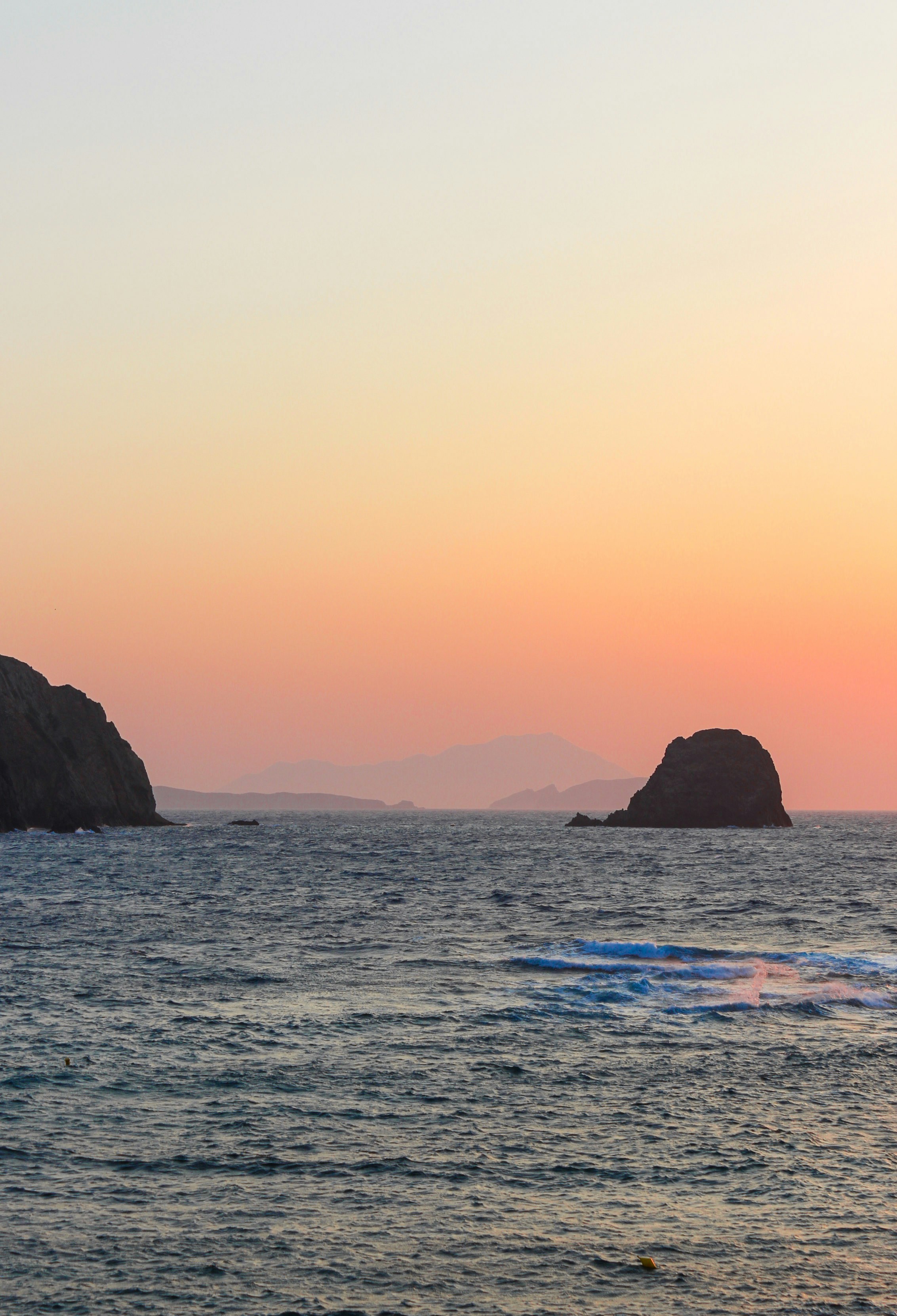 sea sunset view of milos and antimilos from our hotel in pollonia milos greece milos greece