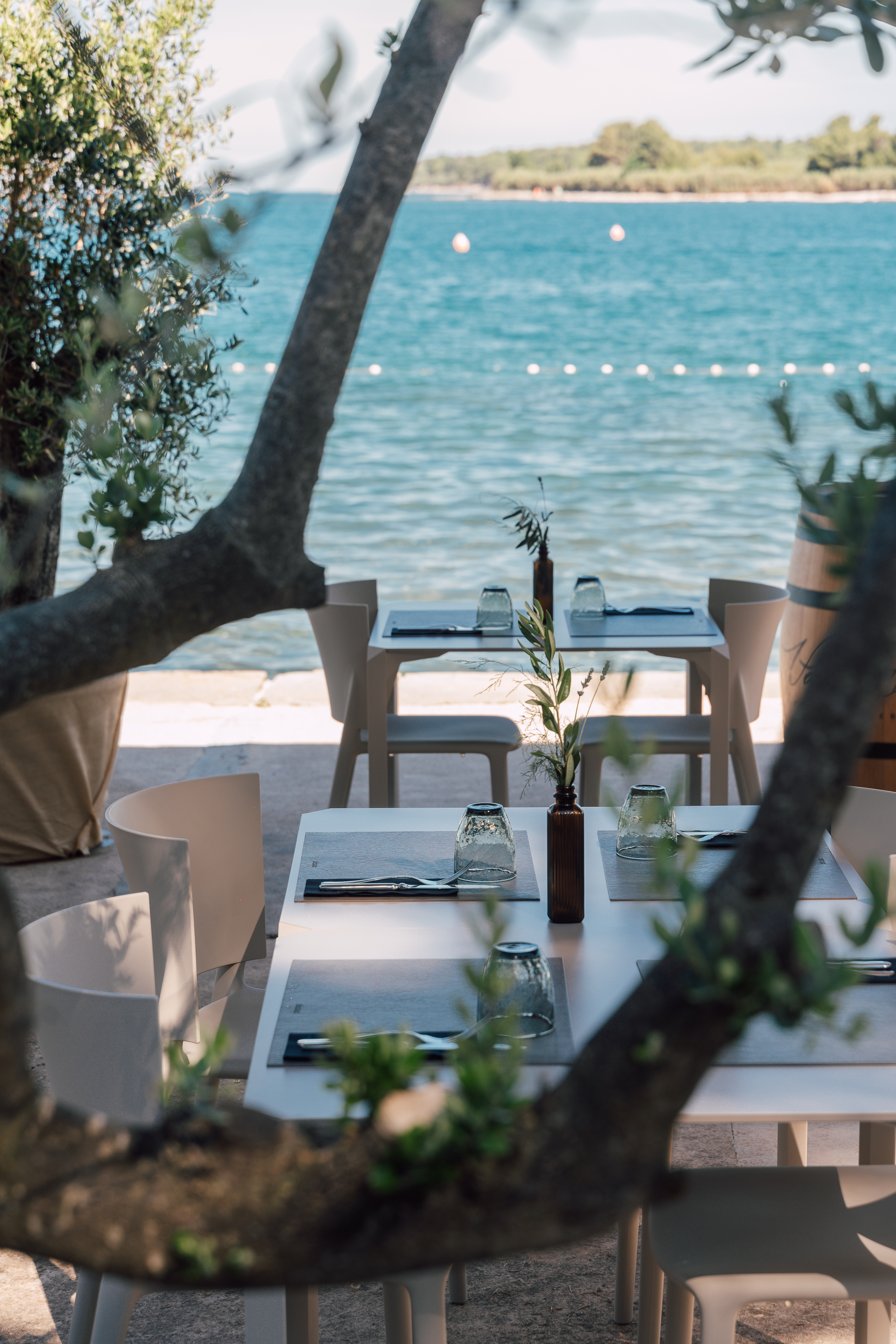 6 tables by the water
