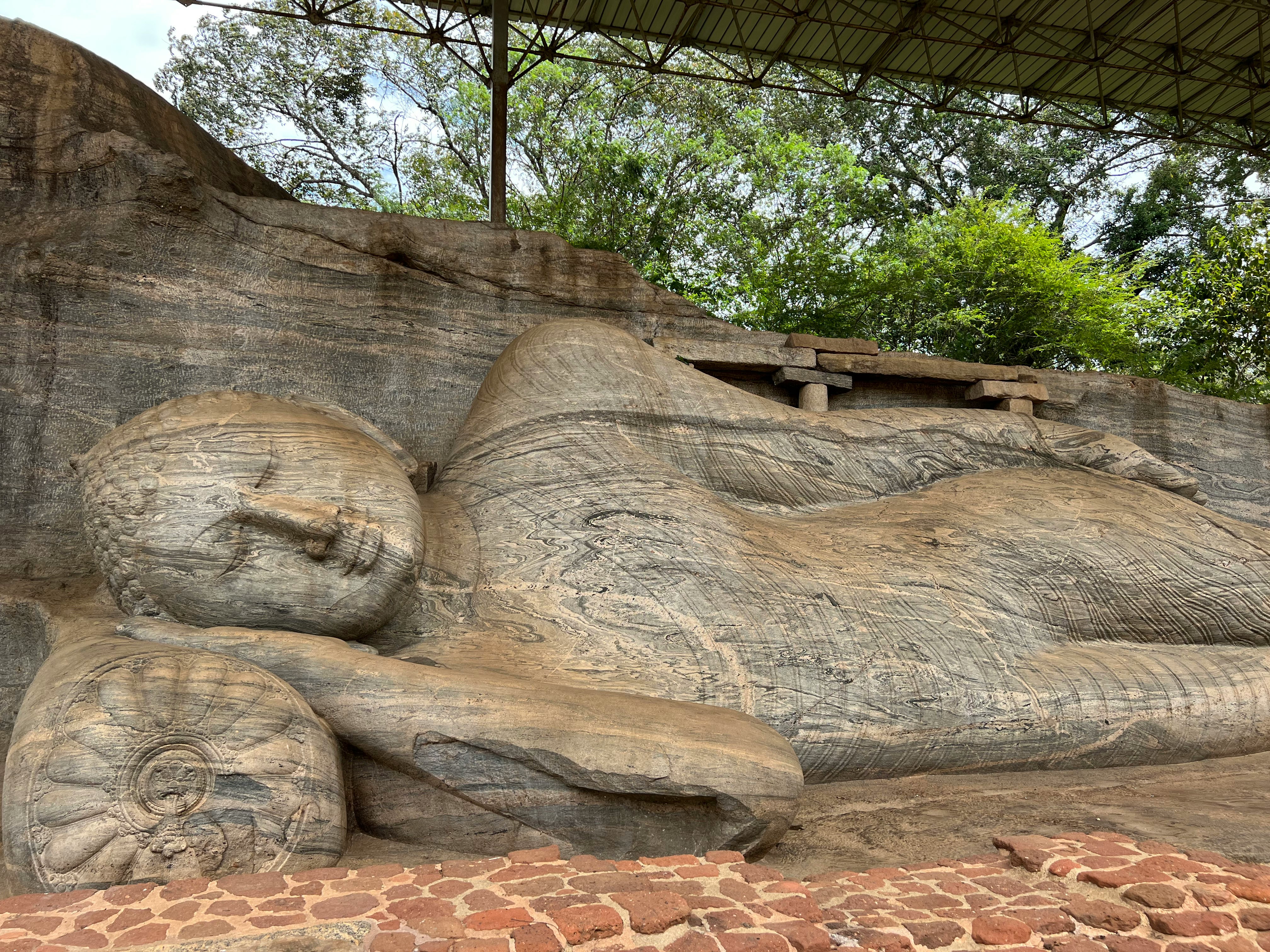 amazed at this giant buddha statue in polonnaruwa sri lanka