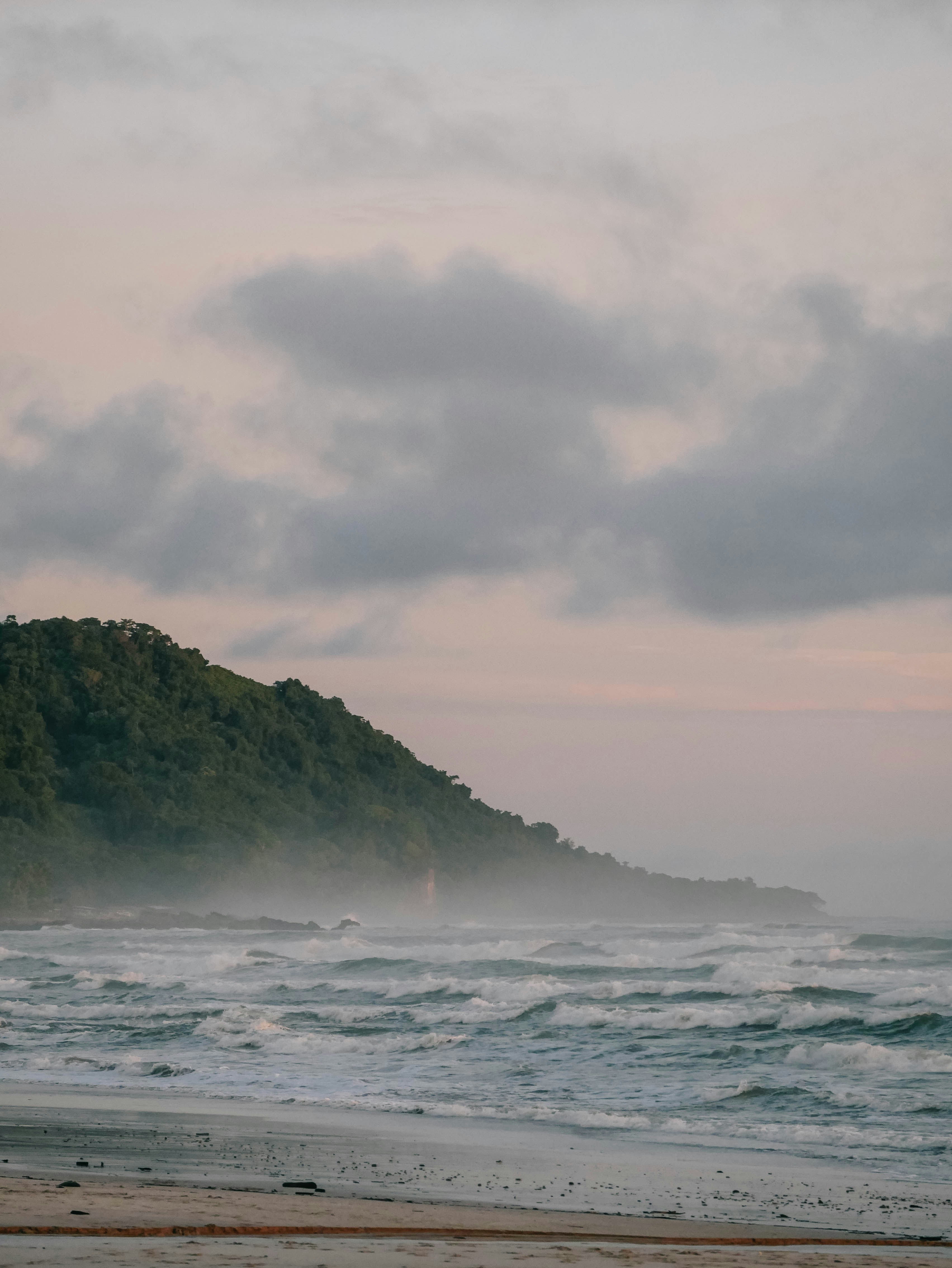 waves crashing during a sunset in santa teresa costa rica
