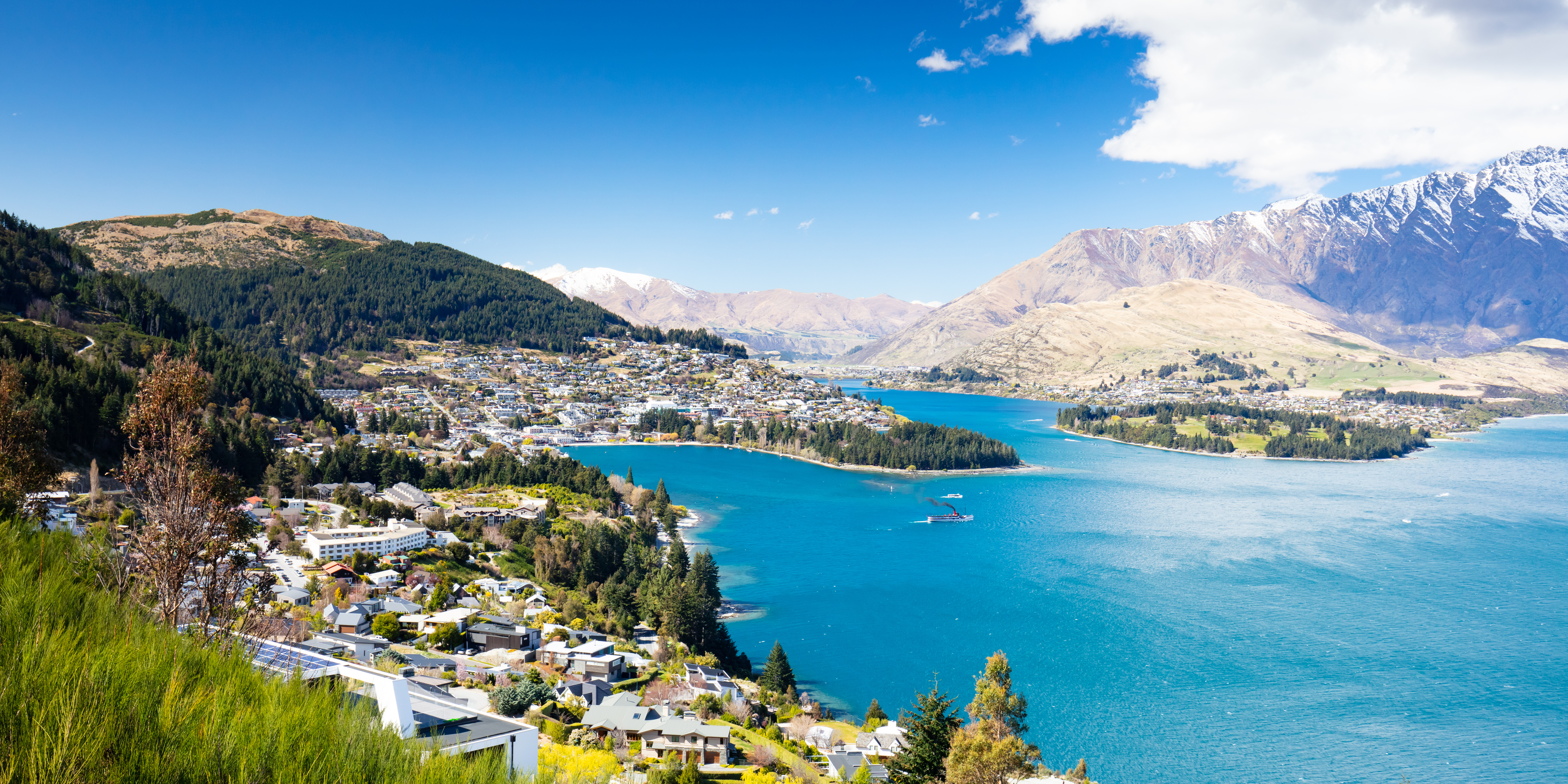 1 a view of queenstown on a sunny spring day in new zealand