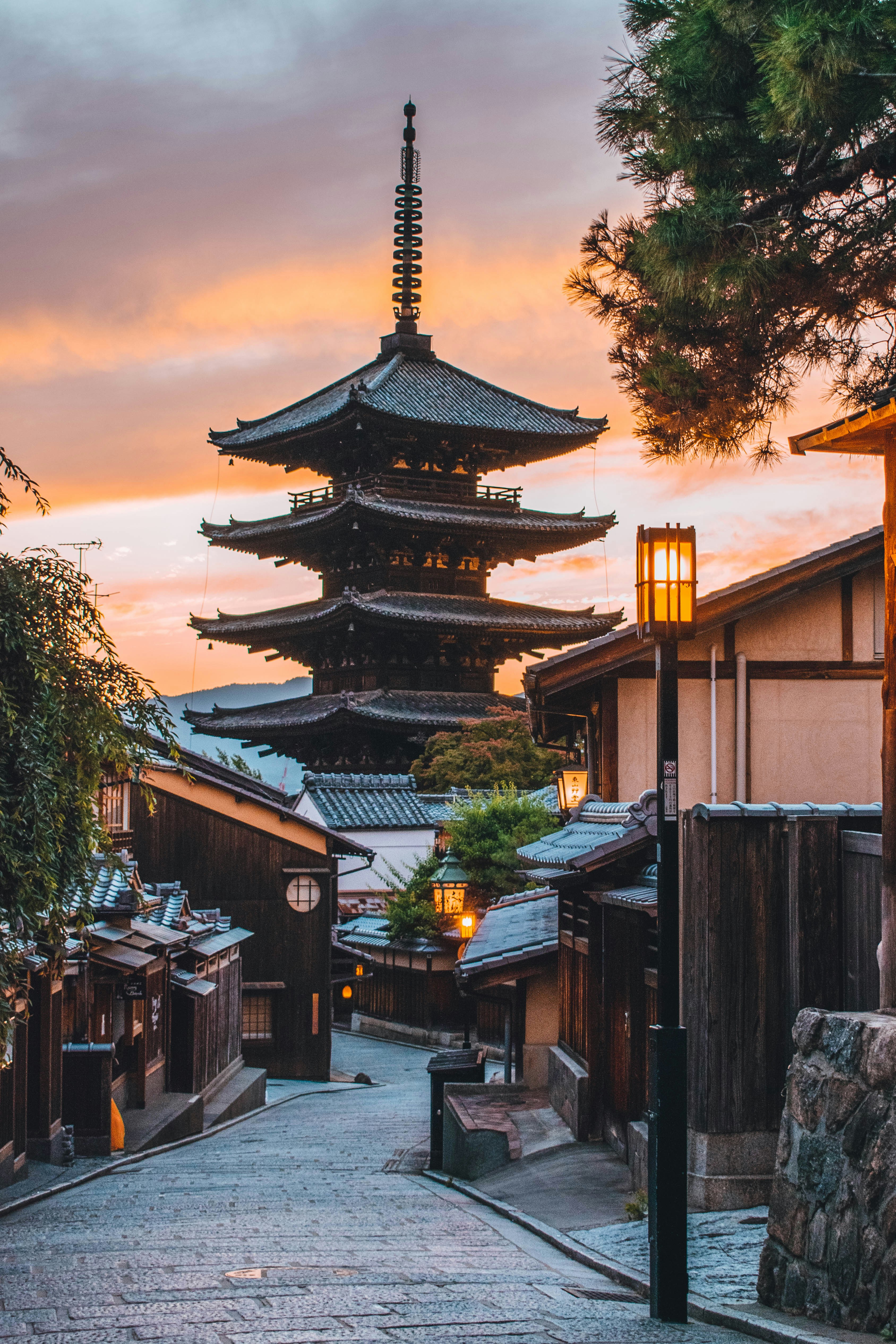 japanese street in kyoto at night in japan with a pagoda